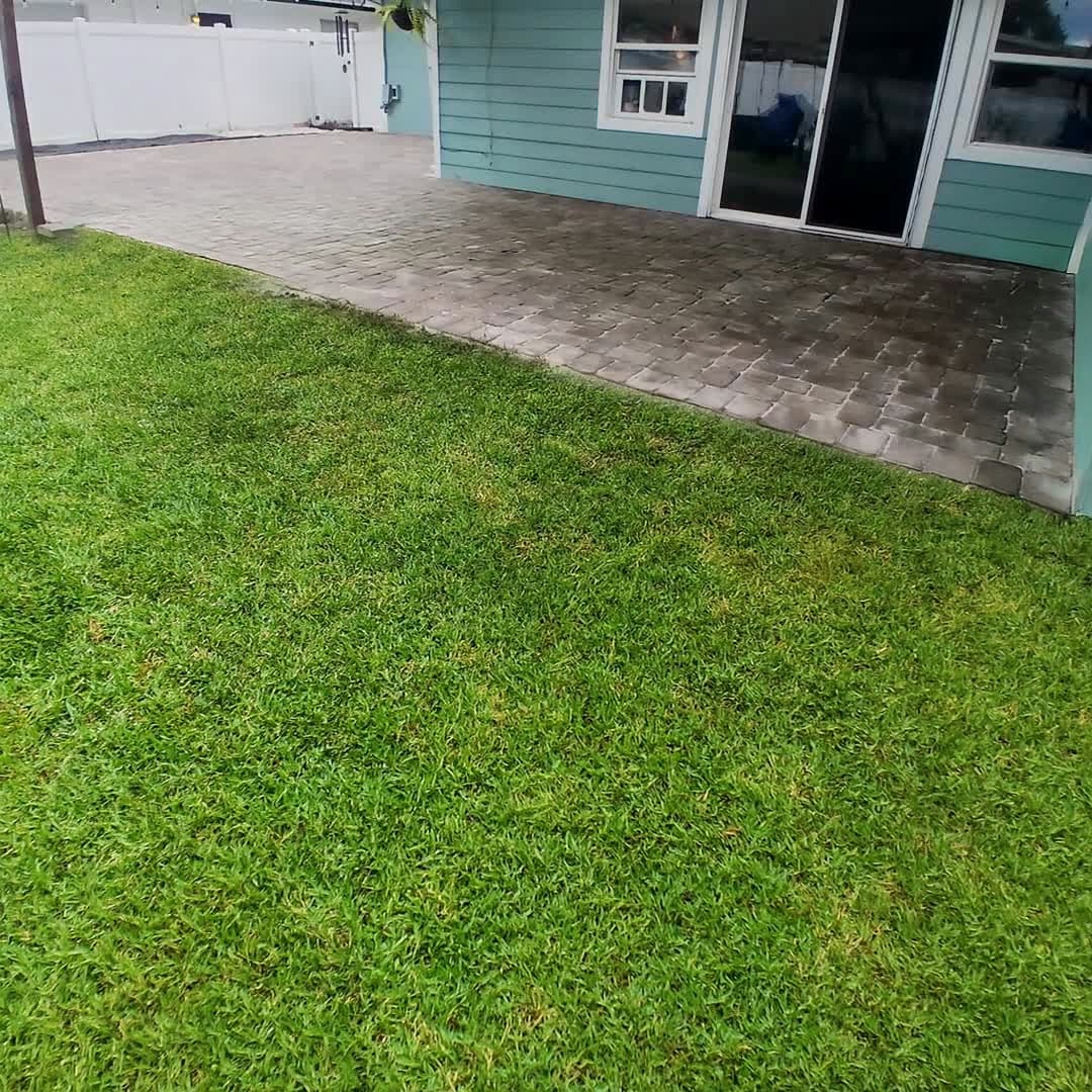 After: the patio relaid level and hosed down