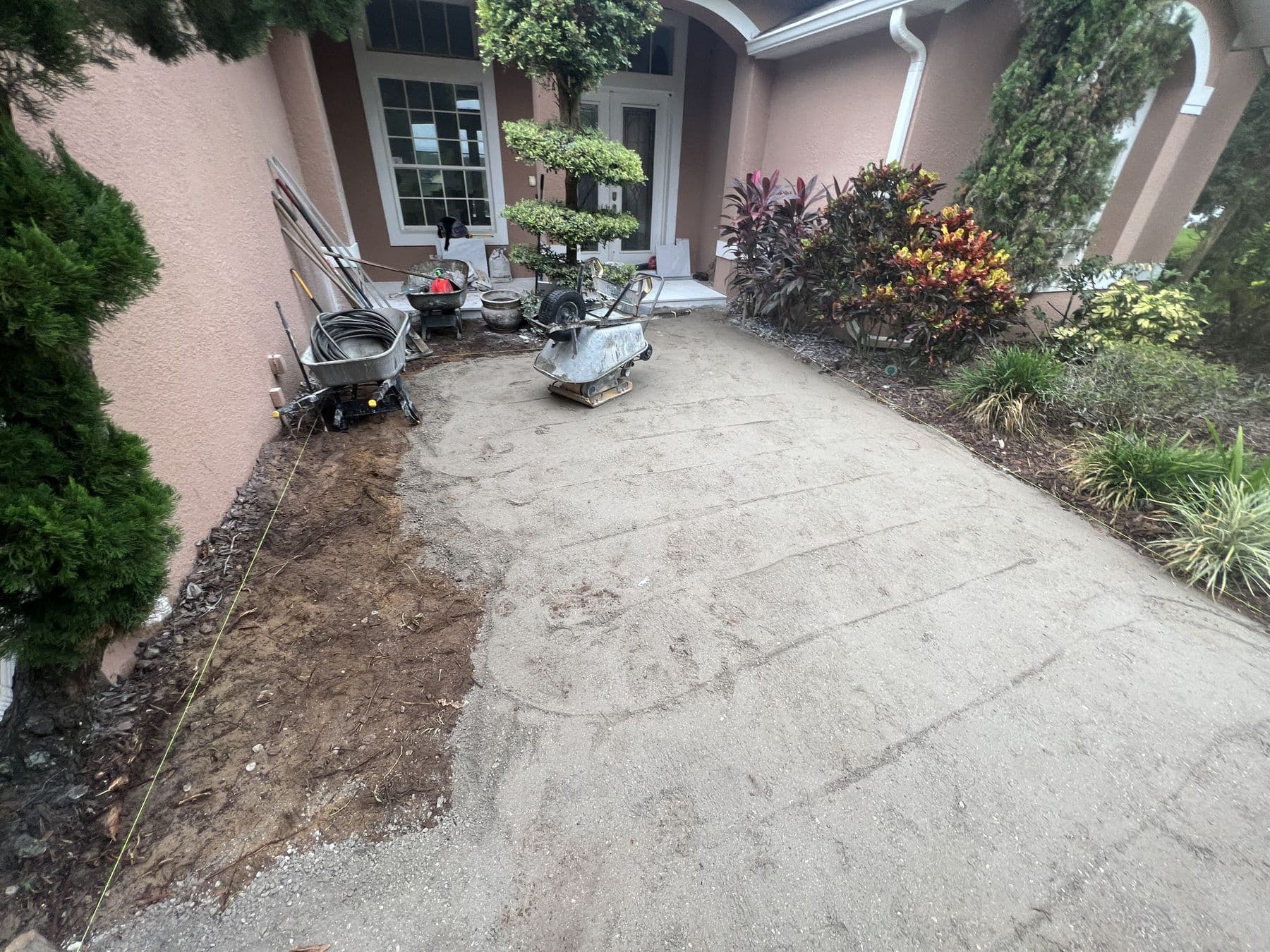 Front entrance with the old concrete broken out and removed, ready for base preparation